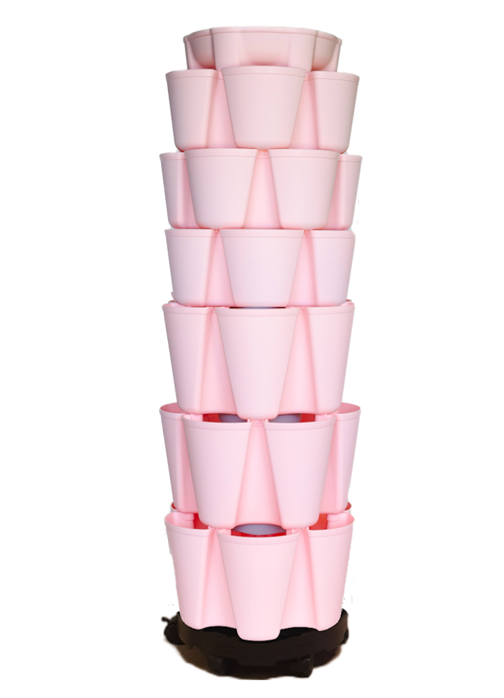 Stack of pink plastic nesting planters on a white background