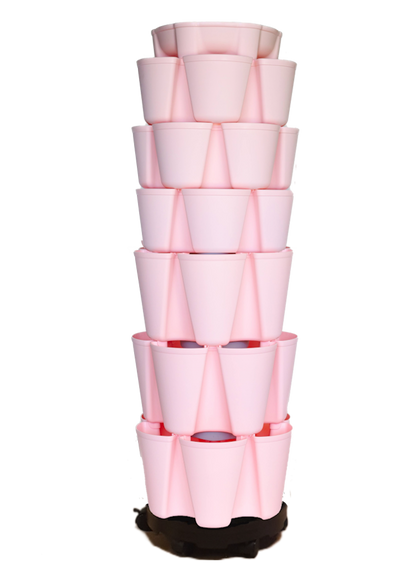 Stack of pink plastic nesting planters on a white background