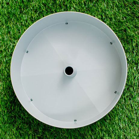 Individual Grey Watering Disk on a lawn  - Grow Towers